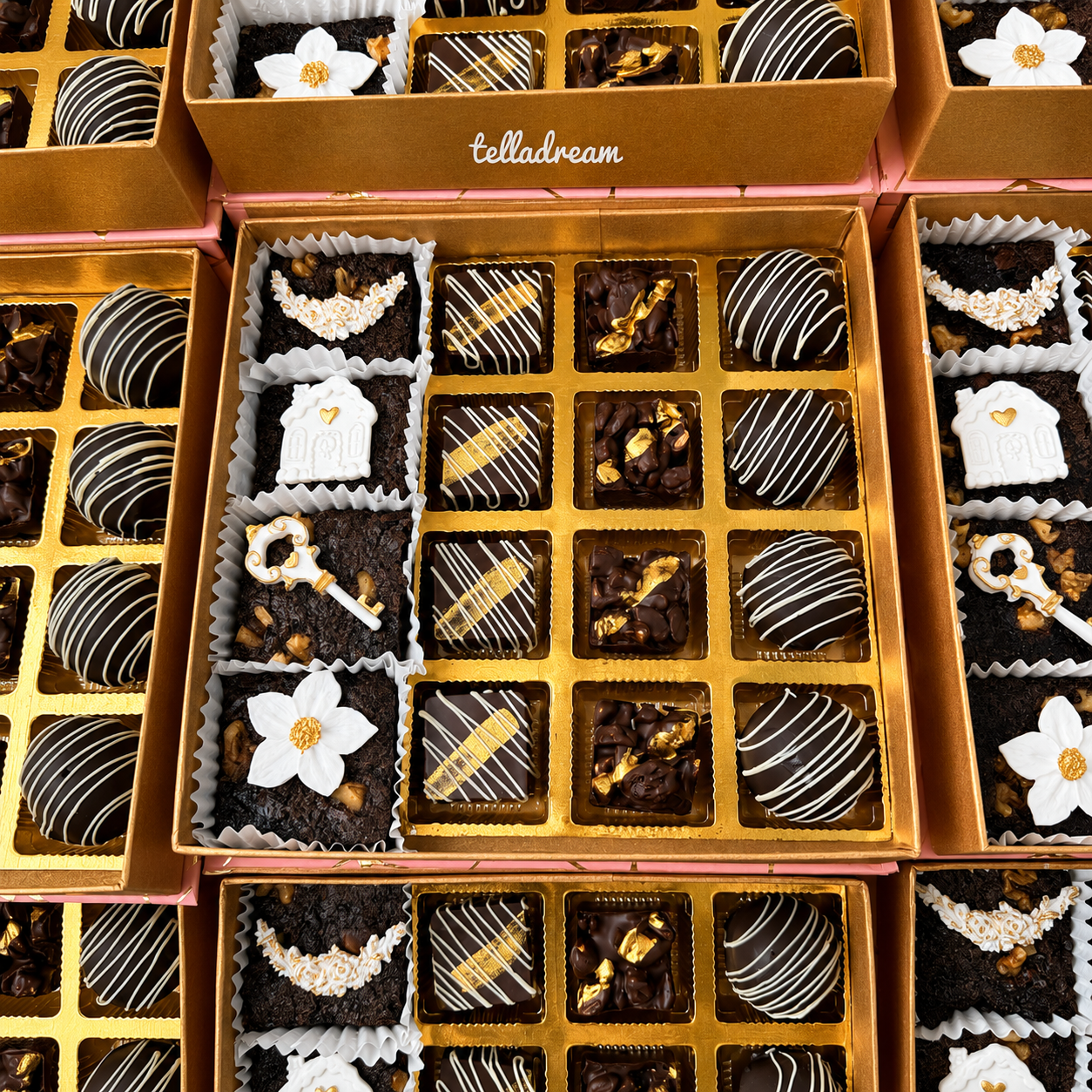 Assorted boxes of brownies and gold-drizzled chocolates